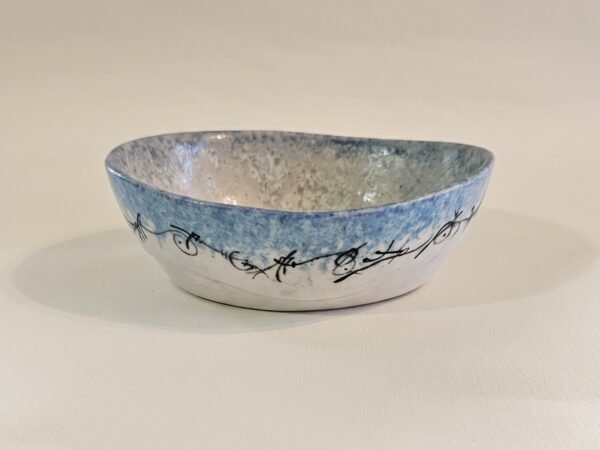 Oval Ceramic Bowl – Calligraphic Line 3x4 Handbuilt oval ceramic dish with black calligraphic line art on sky blue glaze