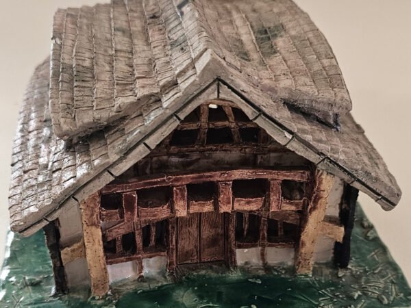 tudor-house-lantern-front-3x4 Handbuilt ceramic Tudor-style timber cottage with tiled roof, chimney and green base