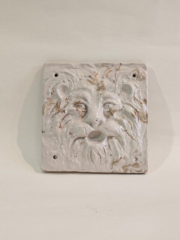 White glazed ceramic Green Man face wall plaque with four mounting holes